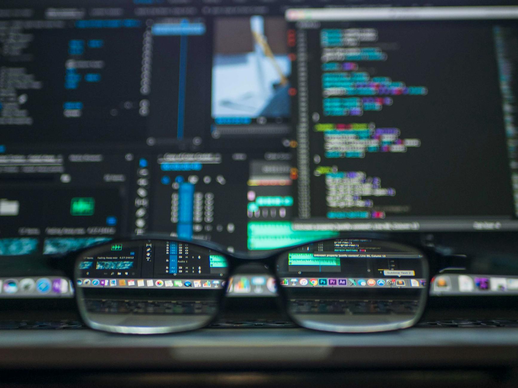 Close‑up of a coding laptop with modern UI